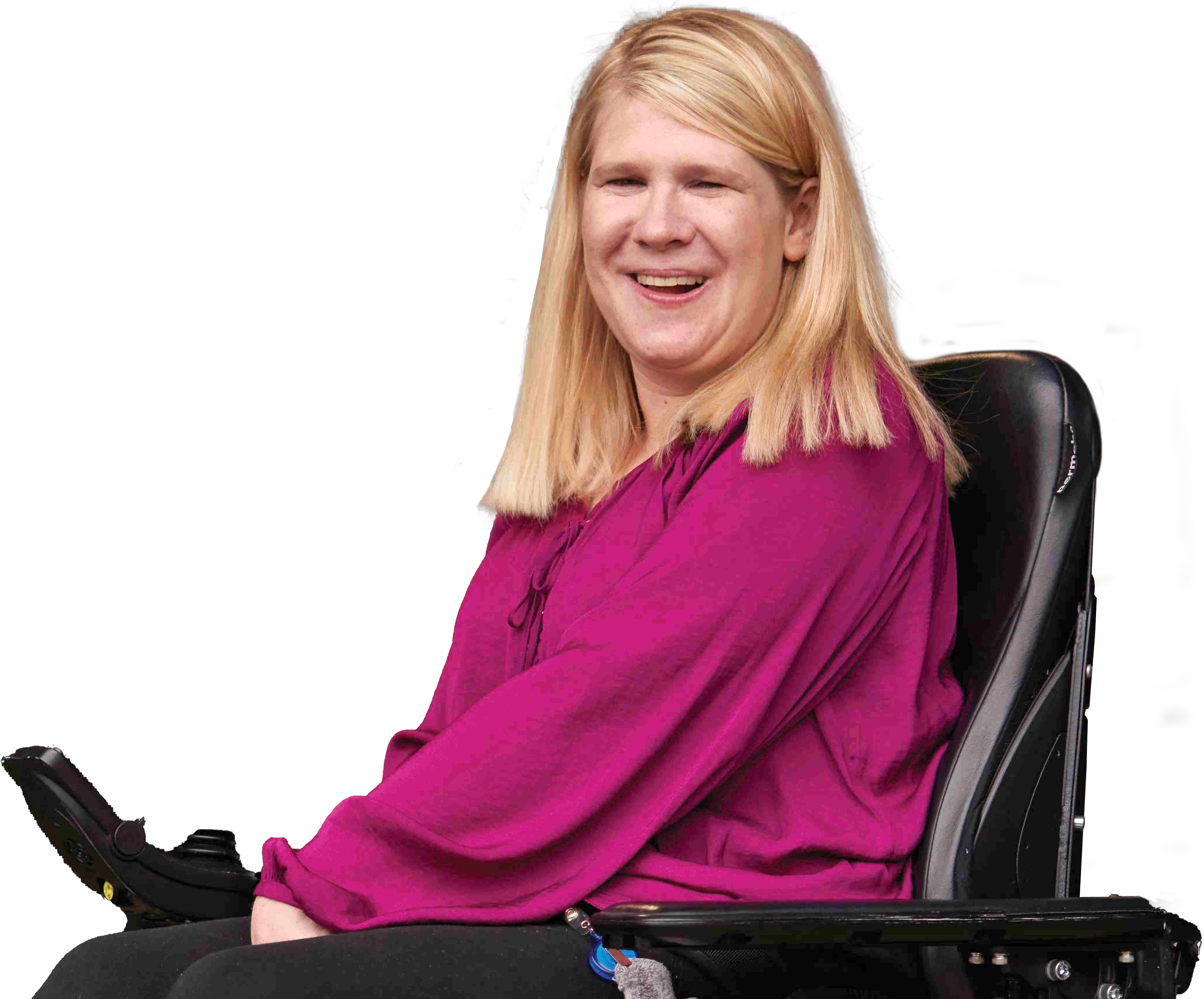 Woman wearing a pink shirt and sitting in a wheelchair