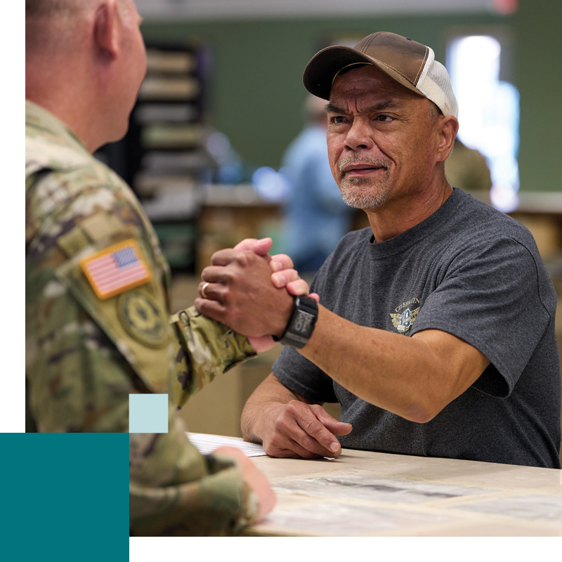 Year In Review Parternship Military man shaking an employee hand