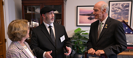 Two Men and a woman meeting