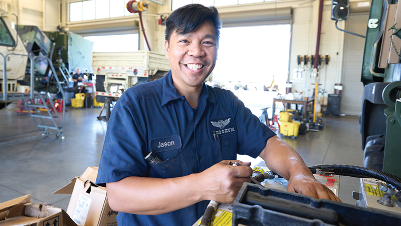 Supporting Military Readiness man smiling in shop