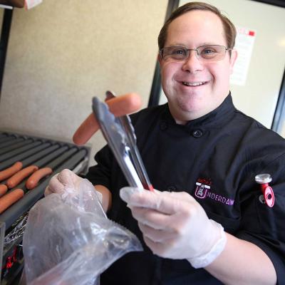 Disability advocate Austin Underwood operates a food truck specializing in making and serving hot dog called Austin’s Underdawgs. 